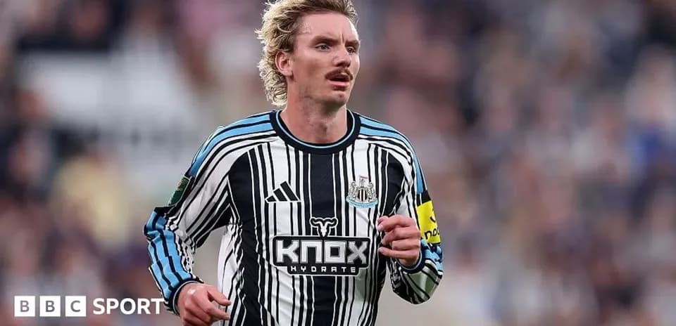 Player wearing Newcastle United kit during match