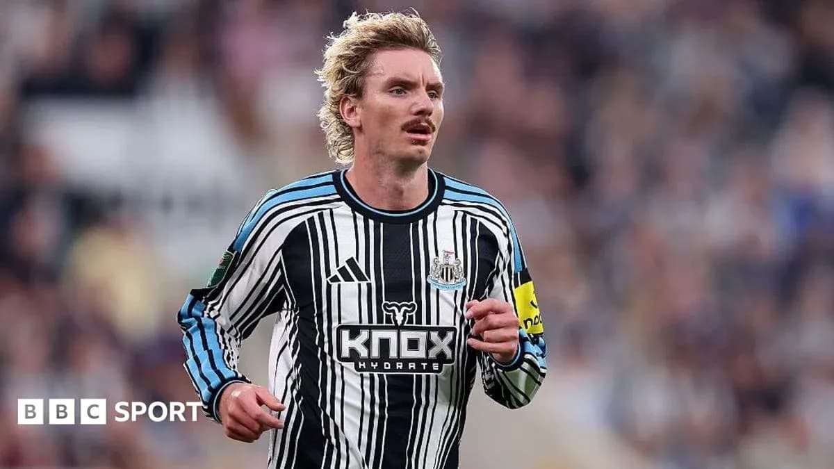 Player wearing Newcastle United kit during match