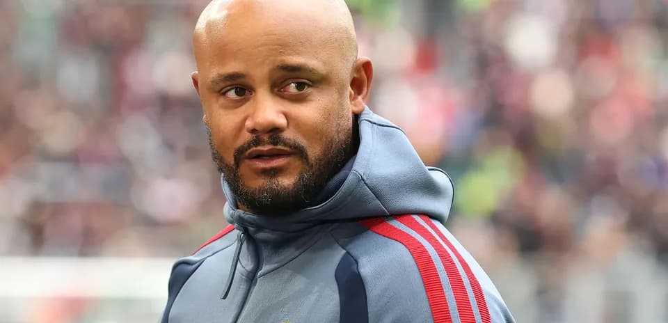 Coach in FC Bayern tracksuit during match