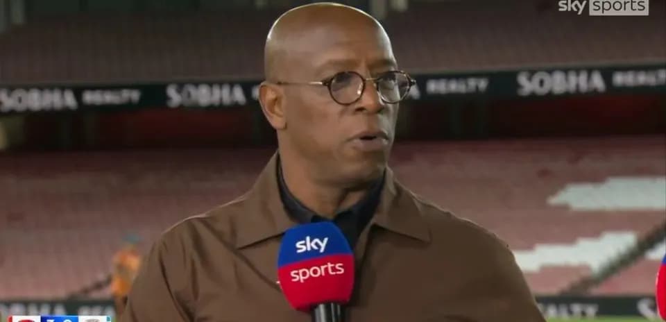 Sports commentator speaking at a stadium studio