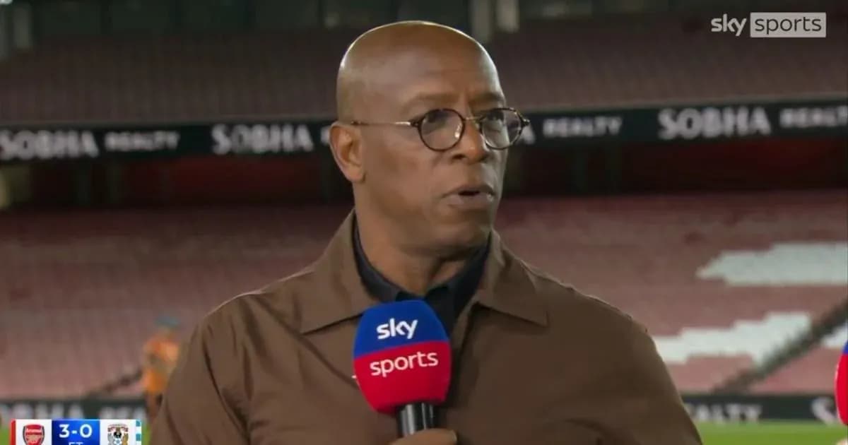 Sports commentator speaking at a stadium studio