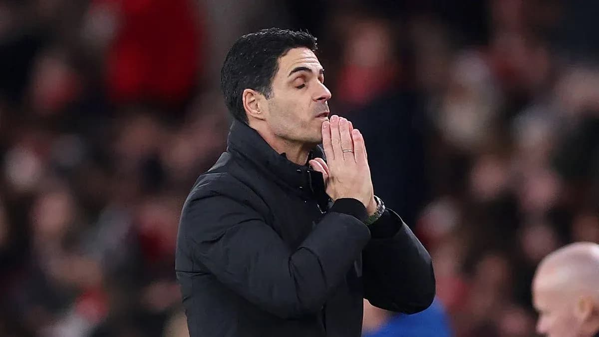 Manager with hands clasped during match