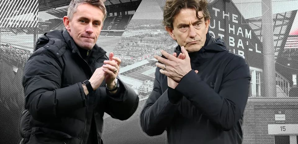 Two football managers applauding at stadium