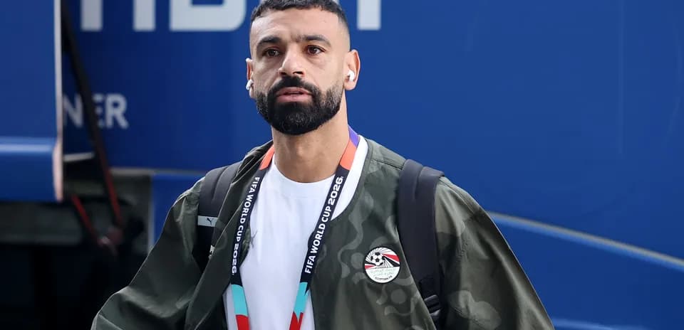 Player wearing headphones arriving at event venue