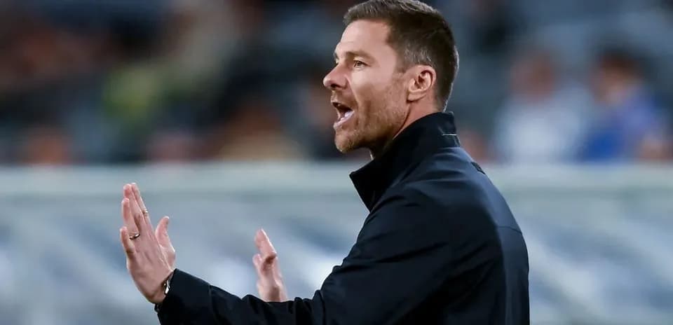 Coach gesturing during a football match on sideline