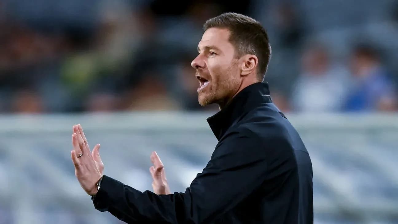 Coach gesturing during a football match on sideline