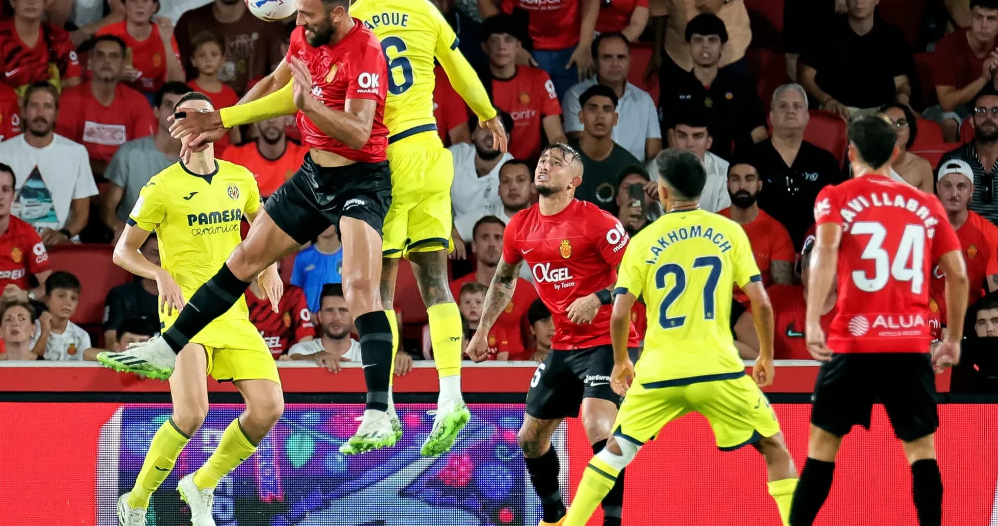 Players competing for the ball in Mallorca match