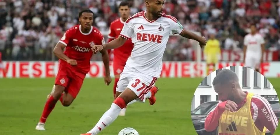Player in white jersey dribbling during match