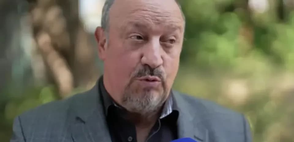 Man speaking during an interview outdoors