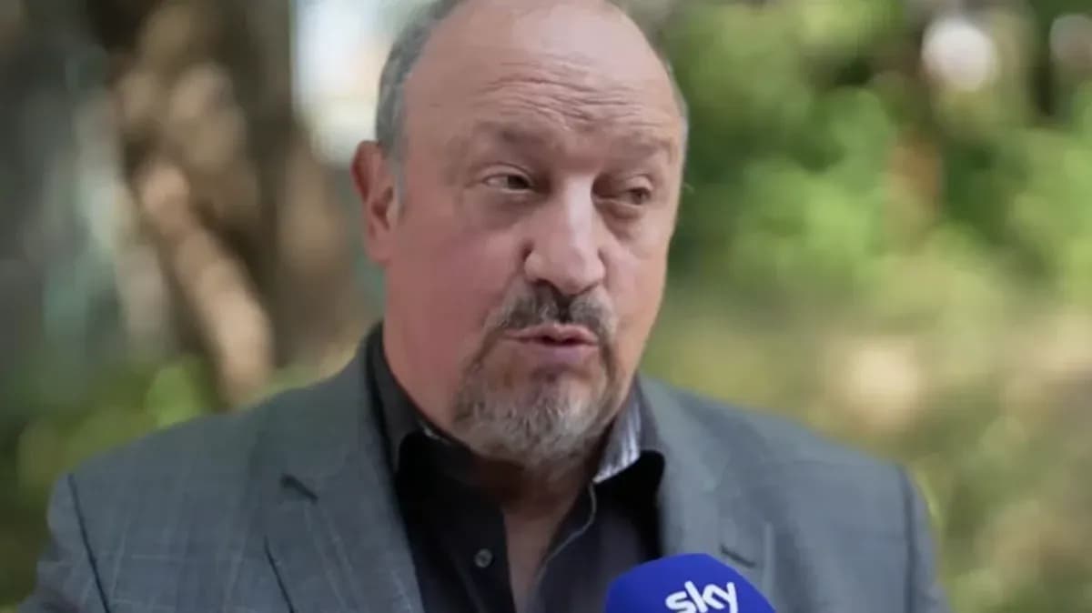 Man speaking during an interview outdoors
