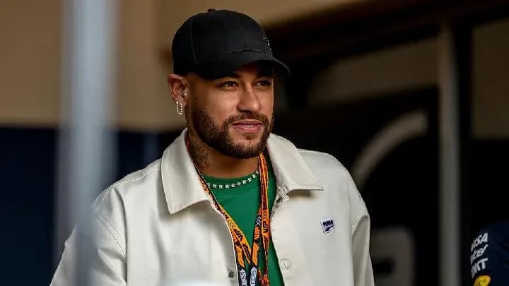 Man wearing a white jacket and cap, smiling