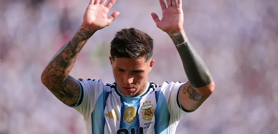 Player raising hands during match for Argentina