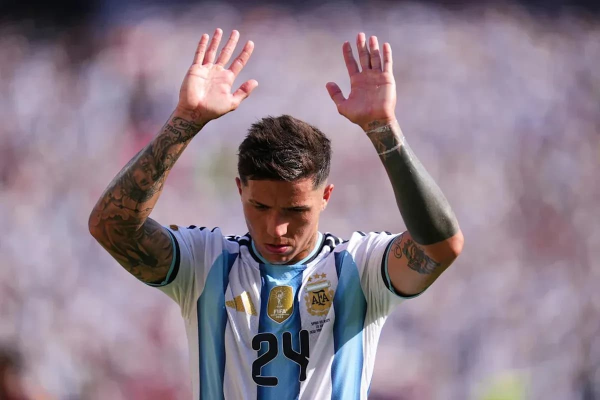 Player raising hands during match for Argentina