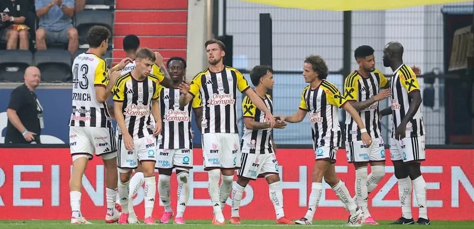 Players celebrating a goal during a match