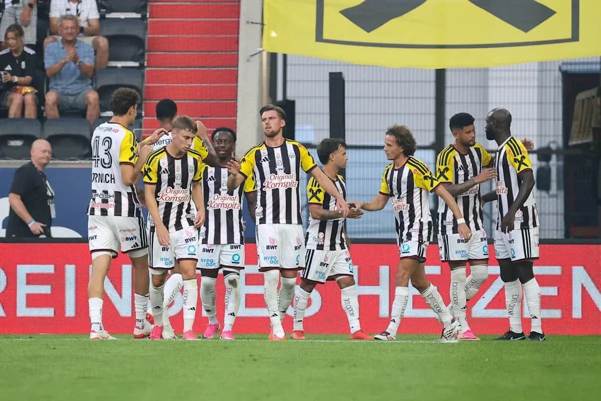 Players celebrating a goal during a match