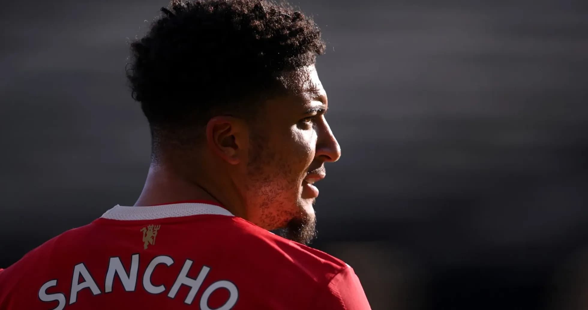 Player wearing red jersey with 'SANCHO' on back