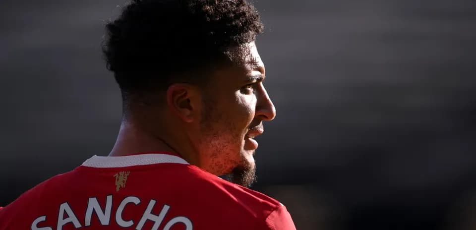 Player wearing red jersey with 'SANCHO' on back
