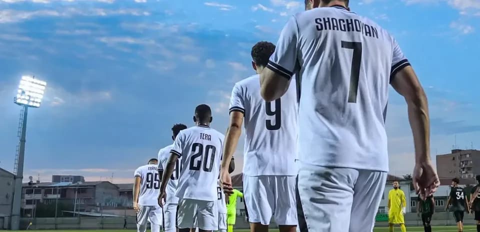 Players walking onto the pitch for match