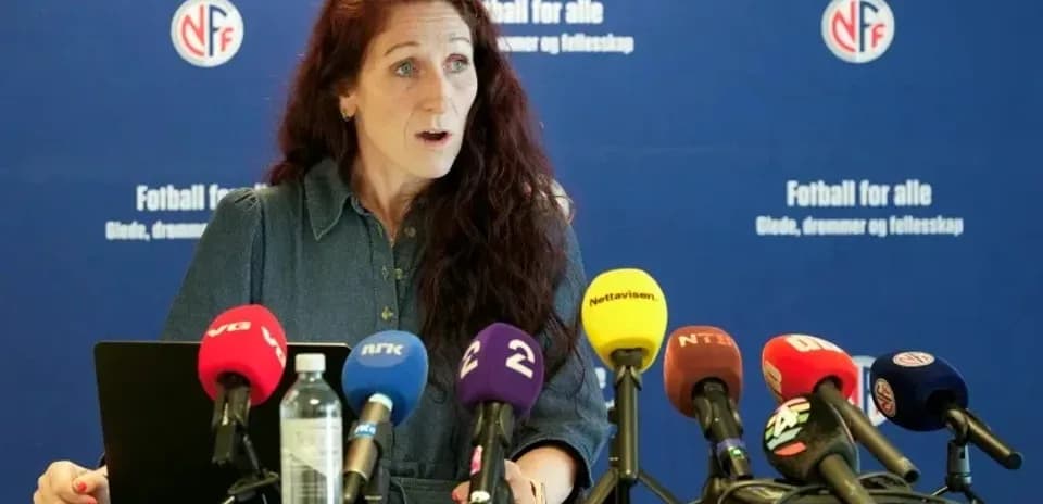Speaker at press conference with microphones in front