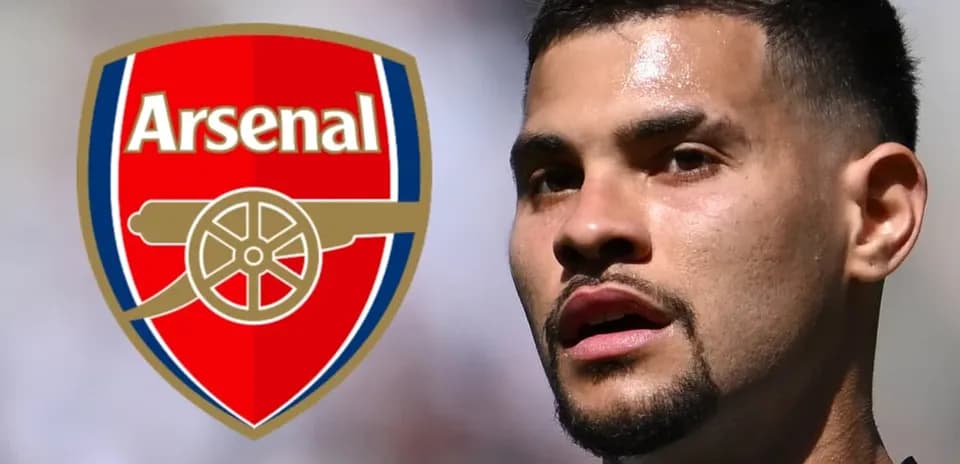 Player in front of Arsenal logo during match
