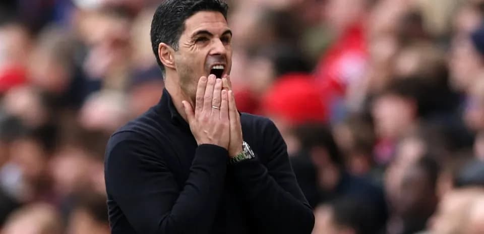 Manager gesturing on the sidelines during match