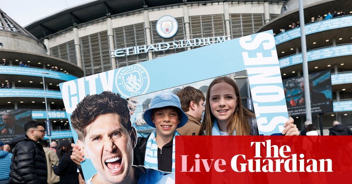 Fans holding sign outside Etihad Stadium before match