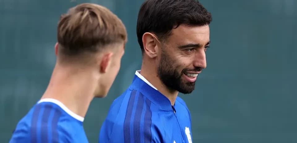 Two players in blue kits during training session