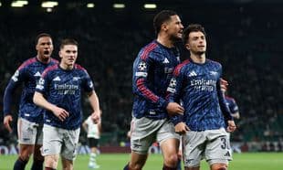Arsenal players celebrating during UEFA Champions League match