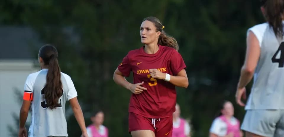 Iowa State player running on the soccer field