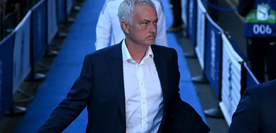 Manager walking down the blue carpeted area