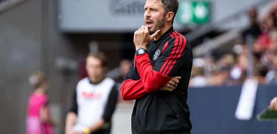Coach observing the match from the sidelines