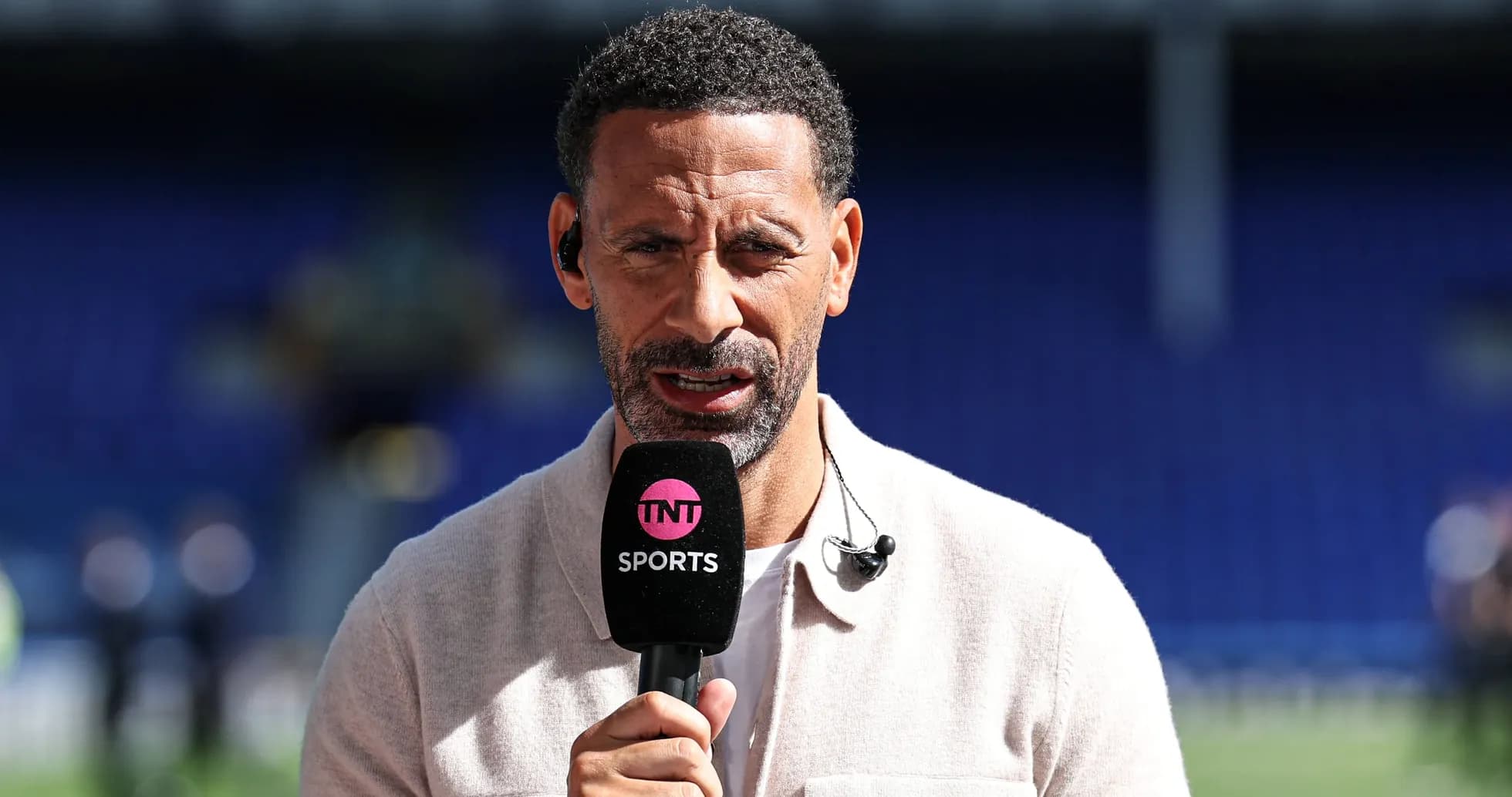 Presenter speaking into microphone during broadcast