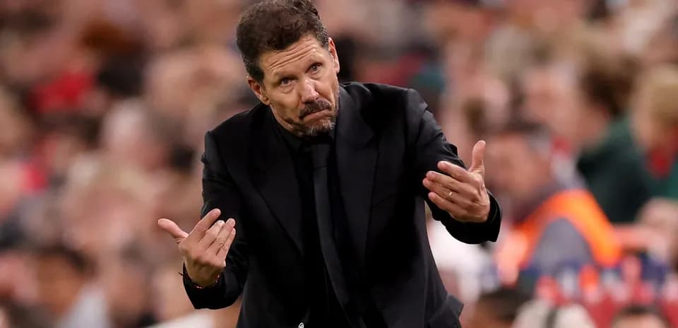 Coach gesturing during a football match