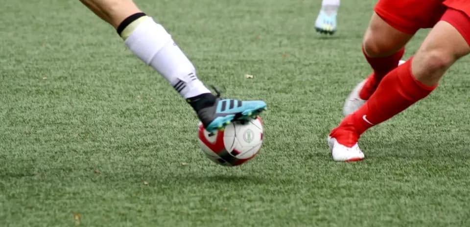 Players contesting the ball during WK-League match