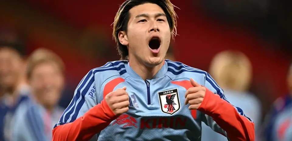 Player celebrating in Japan national team kit