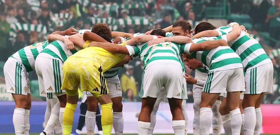 Celtic players huddled together before match