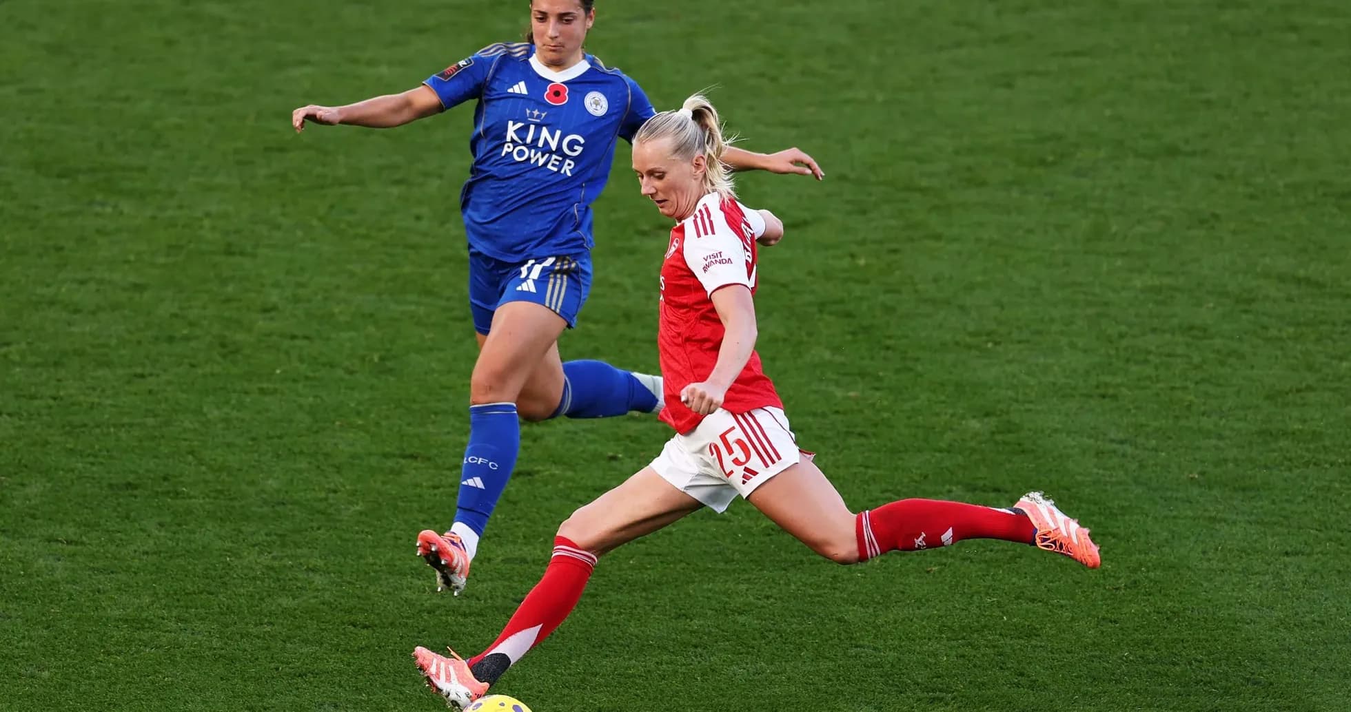 Arsenal player kicking the ball against Leicester City