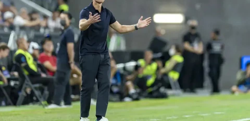Coach giving instructions during a soccer match