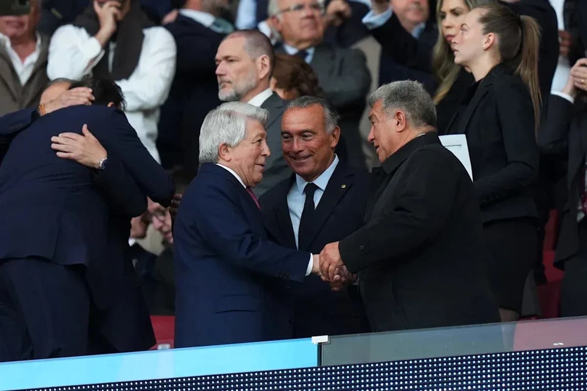 Executives shaking hands in stadium stands