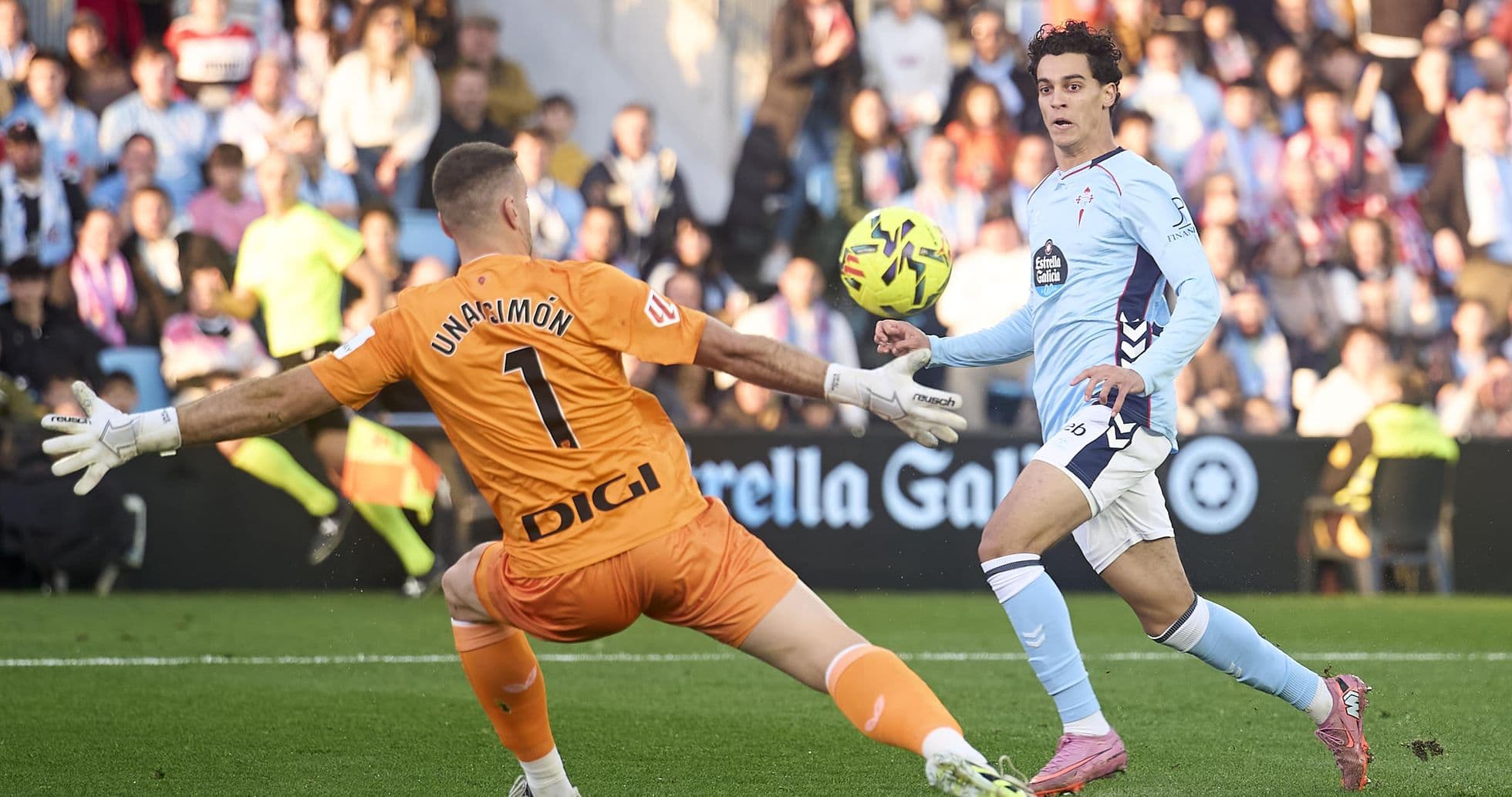 Celta Vigo player attempts to score against goalkeeper