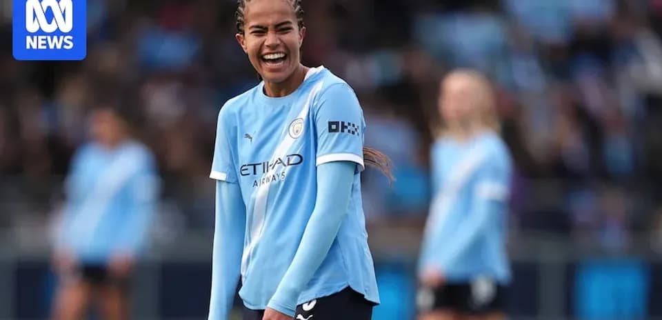 Player smiling during Manchester City women's match