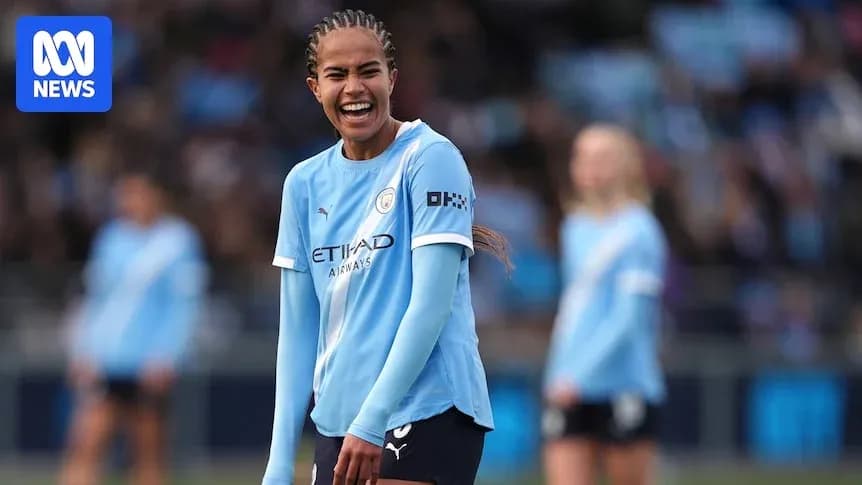 Player smiling during Manchester City women's match