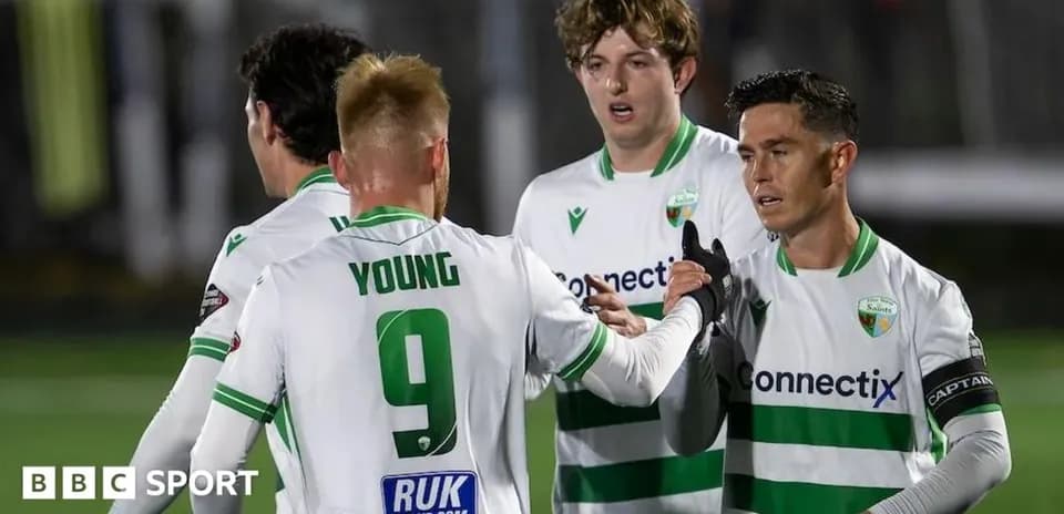 Players celebrating a goal during a football match