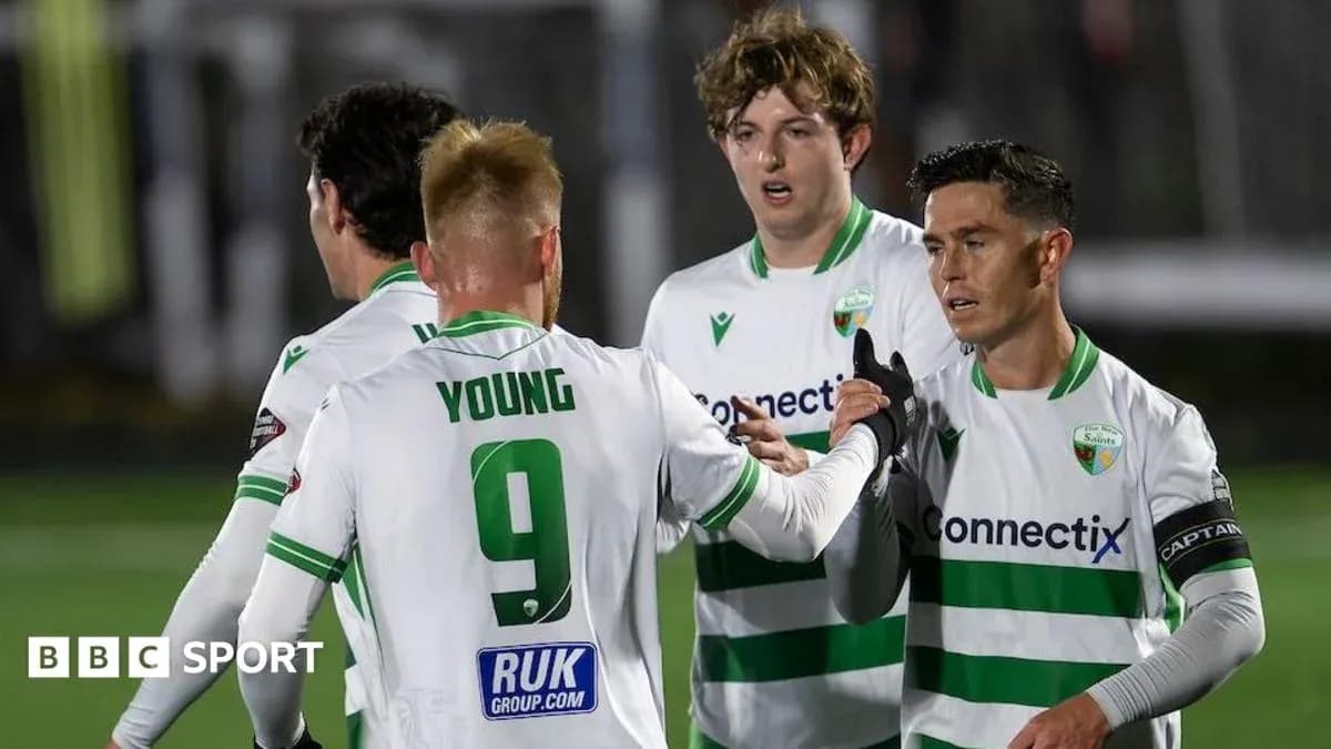 Players celebrating a goal during a football match