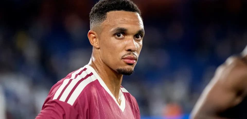 Player in maroon jersey looking at camera