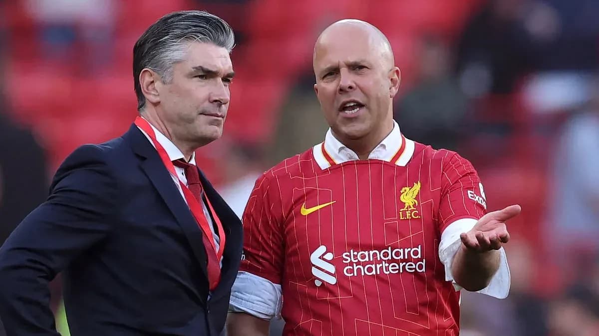 Two men talking in Liverpool FC jerseys