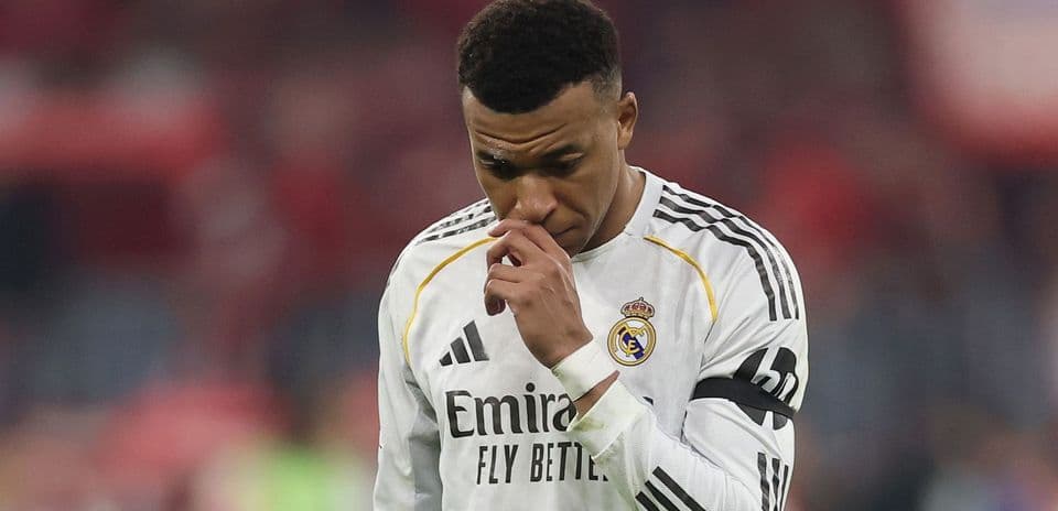 Player in Real Madrid kit walking with head down