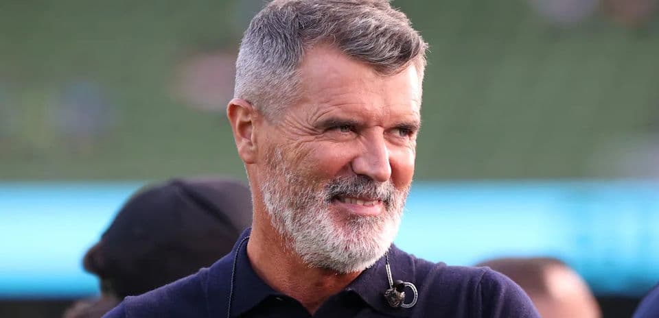 Man smiling in a stadium setting