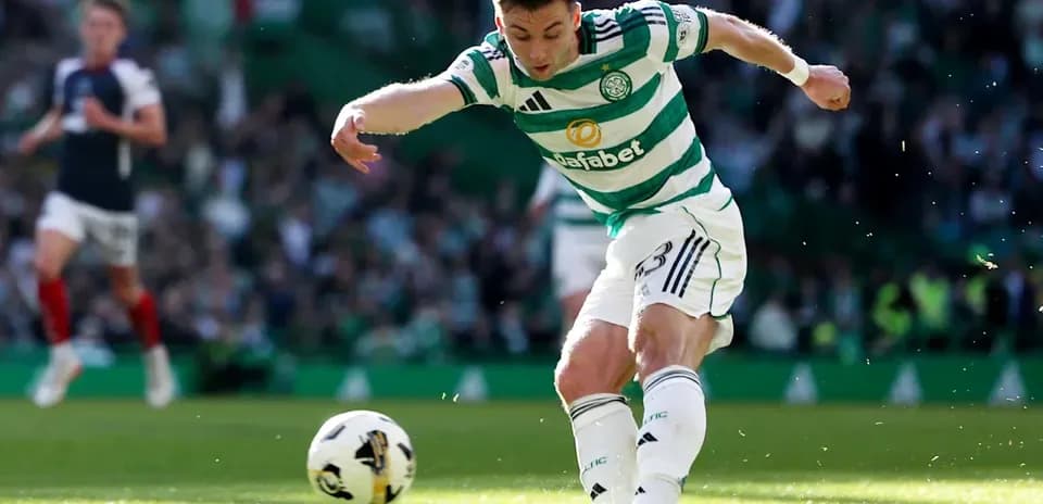 Celtic player kicking the ball during match