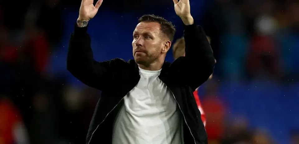Man waving to crowd after match conclusion